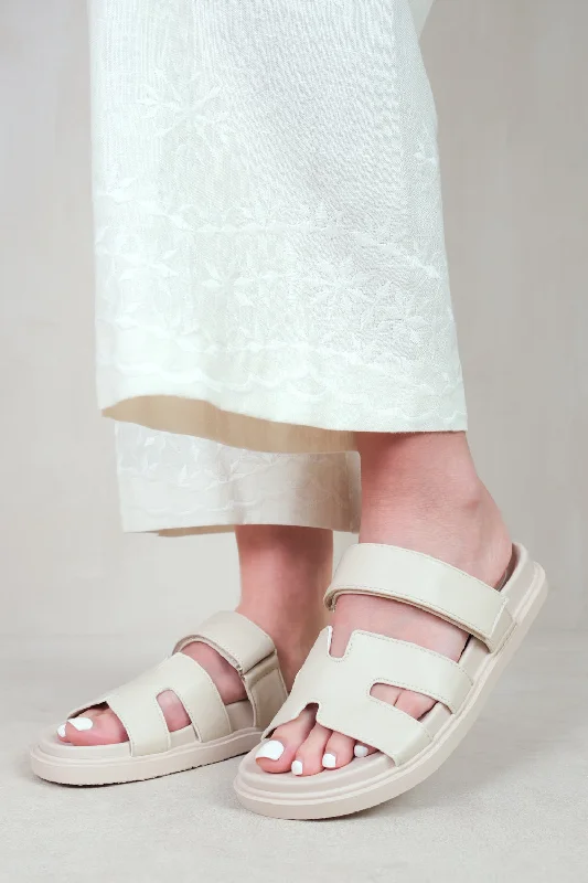 ADAGIO STRAPPY SANDALS IN NUDE FAUX LEATHER